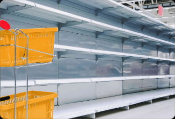 shopping-trolley-against-empty-shelves-in-grocery